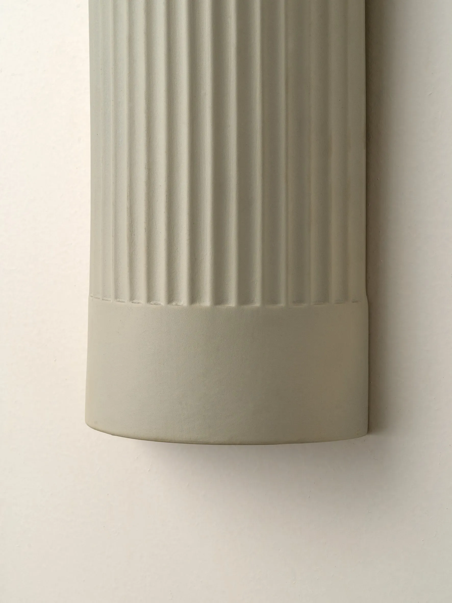 Enza - warm white  ribbed concrete wall light