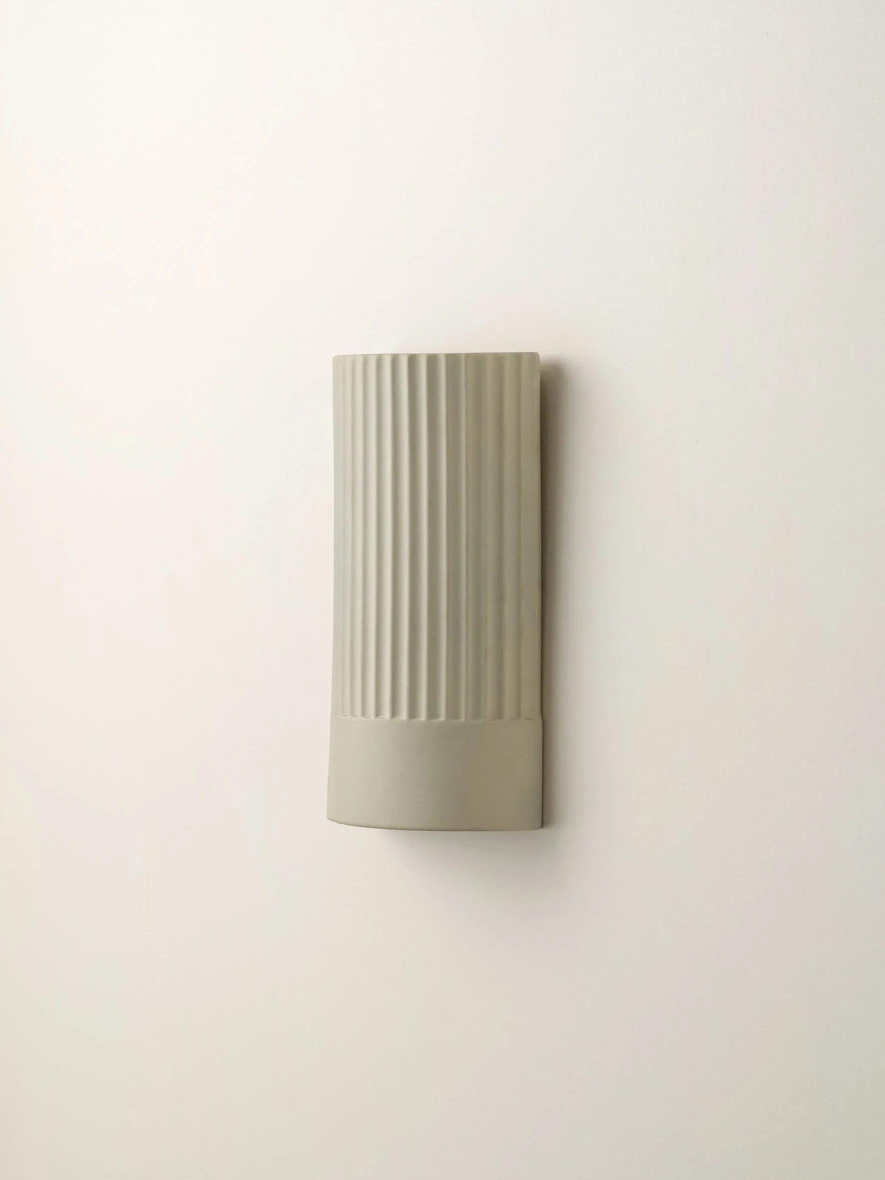 Enza - warm white  ribbed concrete wall light